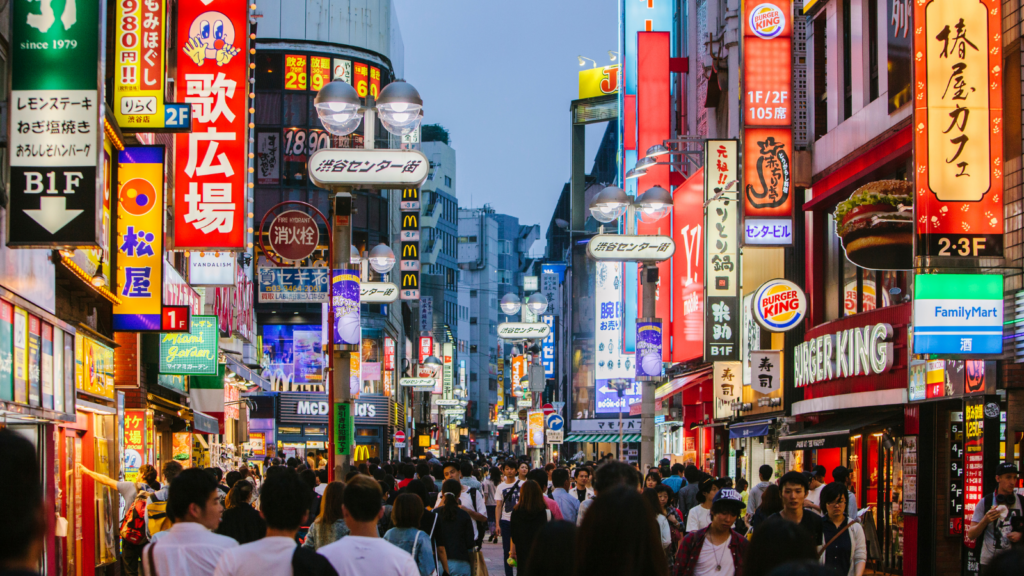 Bright lights of Shibuya shopping district in Tokyo, Japan.