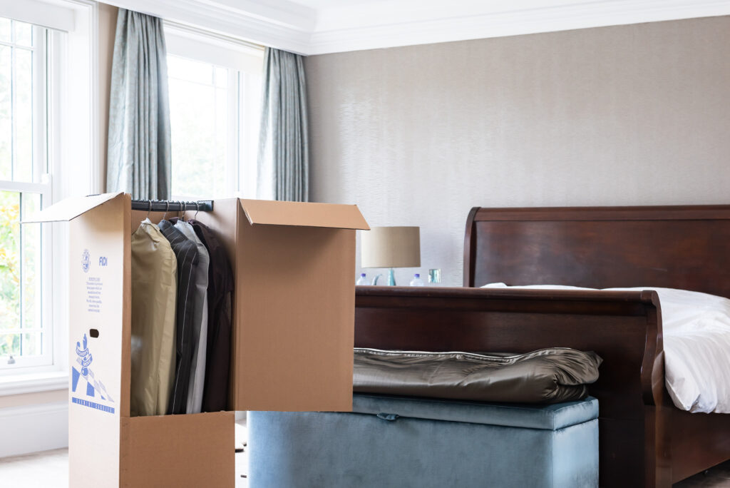 Bishop's Move wardrobe carton in a bedroom.