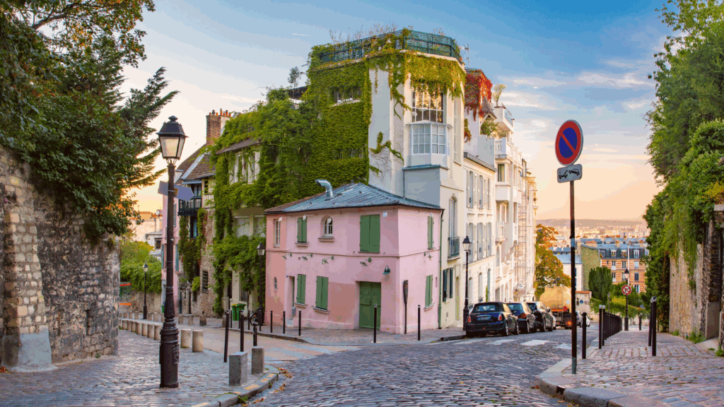 Pink house on cosy street in Montmartre, France.