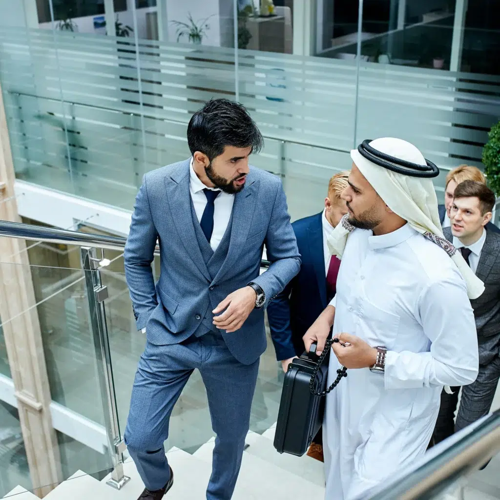 Business professionals walking to meeting up steps in Dubai